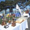 Table with LSFYC trophies and scrapbook.
