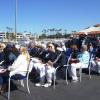 Attending guests enjoy the sunshine while awaiting the ceremony.
