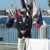 Bill Ives hoists the Officer flags.

